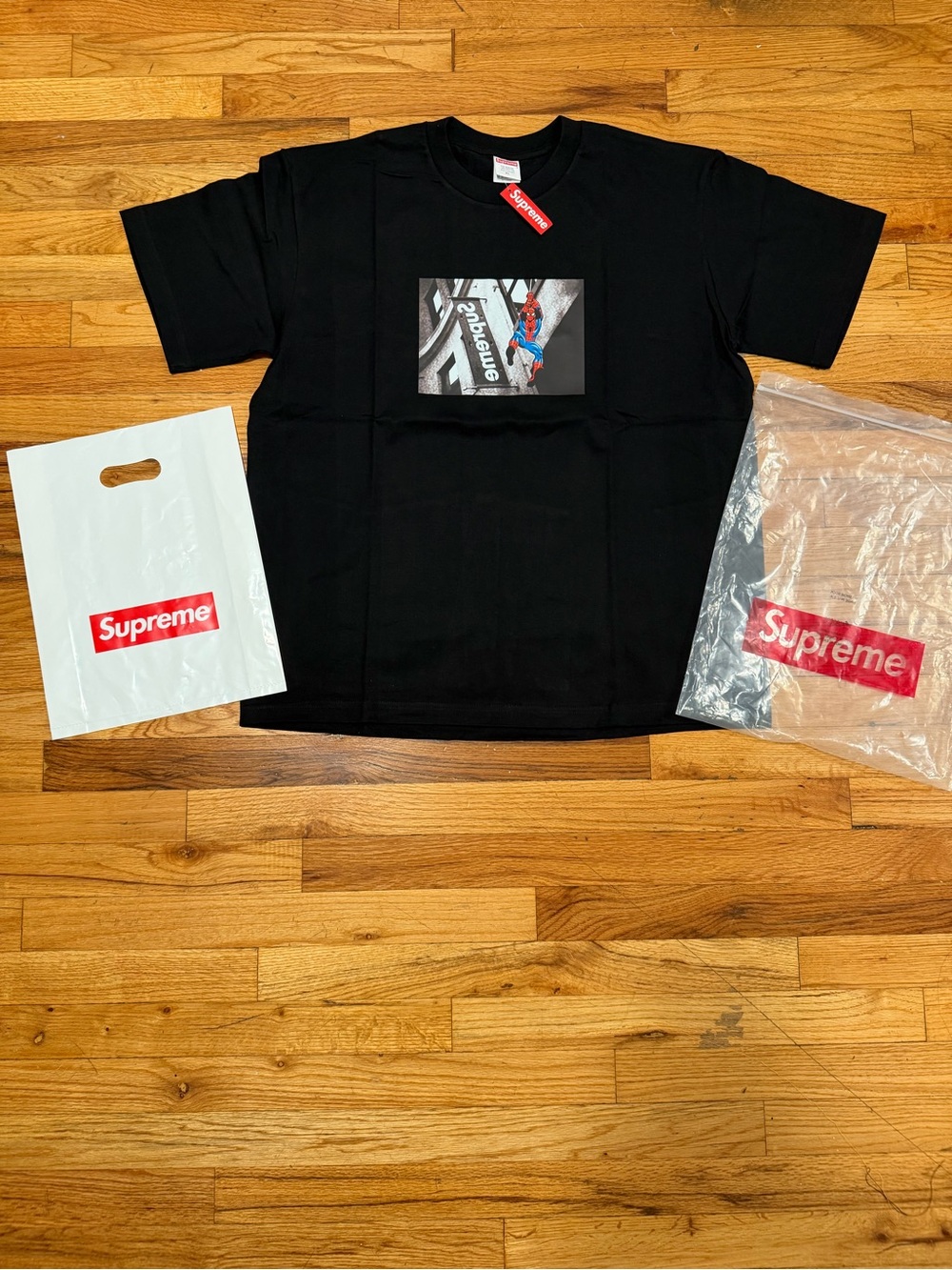 Supreme Black Kids Graphic Tee with Red Logo Tags